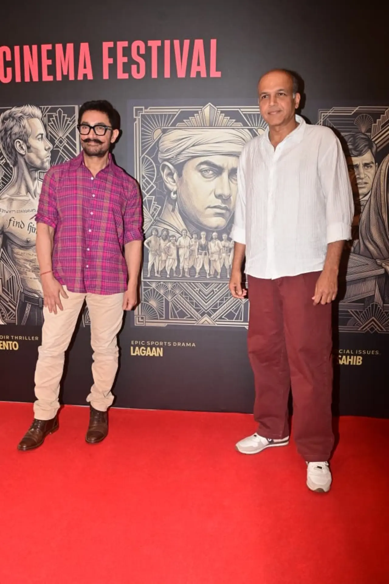 Aamir Khan attended the Red Lorry Film Festival in a pink and blue shirt paired with beige trousers and brown shoes. He posed at red carpet with Ashutosh Gowariker.